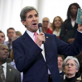 Clinton’s Shadow Looms Large as Kerry Arrives at State